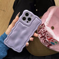 Water ripple TPU iPhone case in light pink with anti-fall and anti-fingerprint finish, oil-filled wave texture