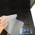 Transparent silicone keyboard dust film for 15 inch laptop showing close fit over keys