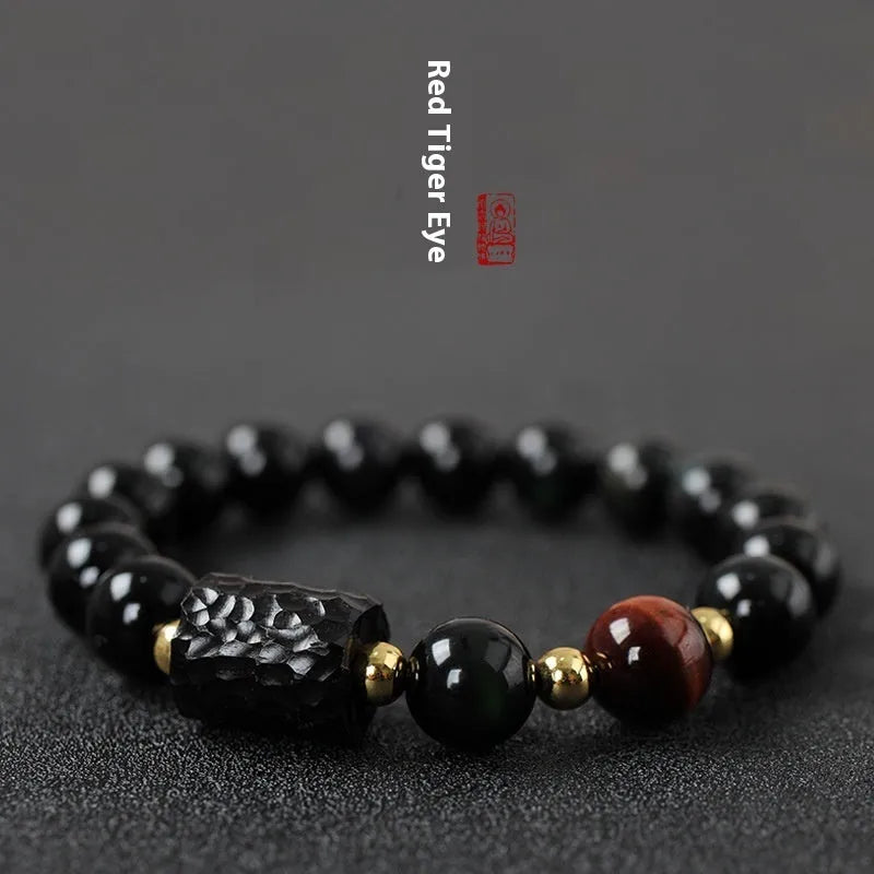Obsidian bracelet with tiger eye beads in 10mm size showing manual craftsmanship and unisex design
