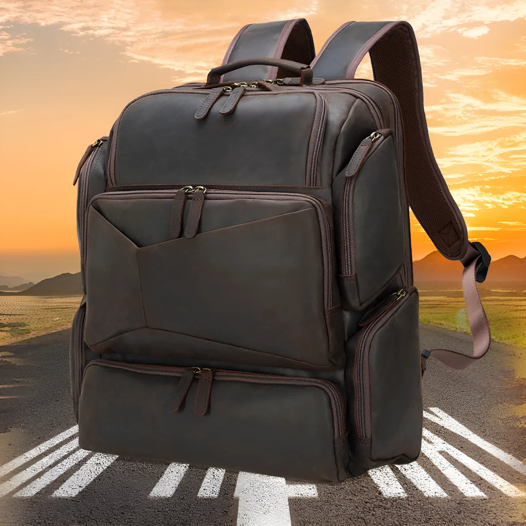 Dark brown retro leather backpack for men with a 17-inch laptop compartment open.