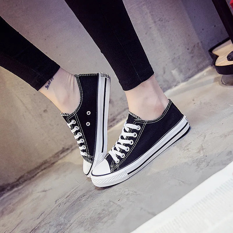 Women's casual canvas shoes in solid colours showing black, white black, white red and all black options