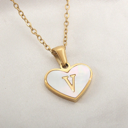 A personalized heart-shaped necklace with a 26-letter charm, crafted from high-quality stainless steel and gold plating.