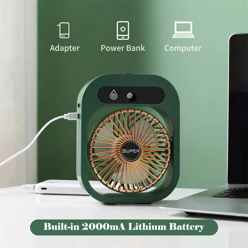 Green and white USB portable misting fan humidifier on a desk showing adjustable vent and water tank.