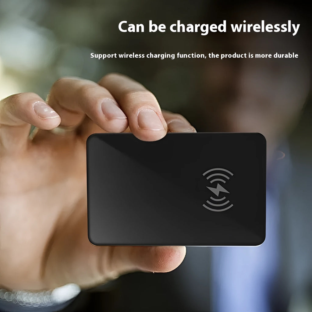 Black plastic pet tracking device with card shape, hanging hole, and wireless charging via NFC interface