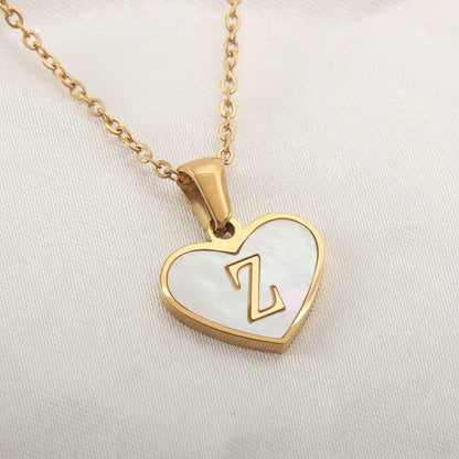 A personalized heart-shaped necklace with a 26-letter charm, crafted from high-quality stainless steel and gold plating.