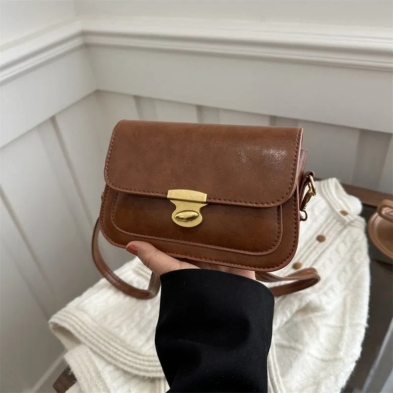Retro small square handbag in soft brown PU leather with horizontal orientation