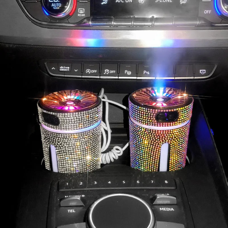 Rhinestone-decorated USB car humidifier with LED lights on a dark background.