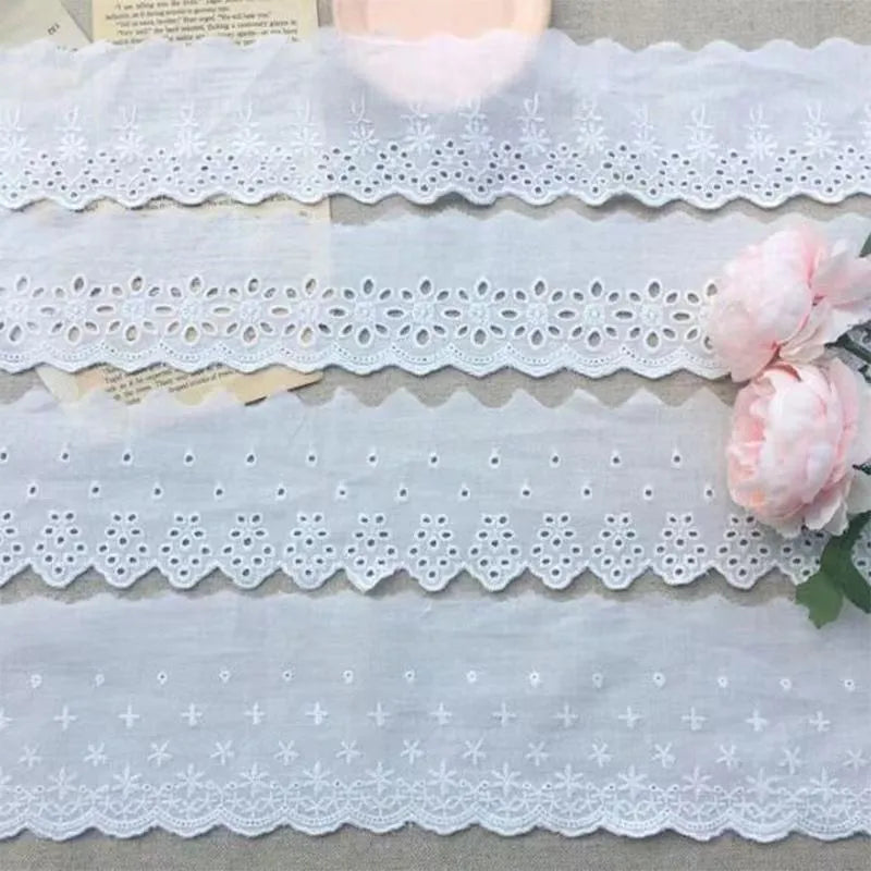 Close-up of white cotton embroidered lace trim showing cut-out pattern, with four width style options for DIY sewing.
