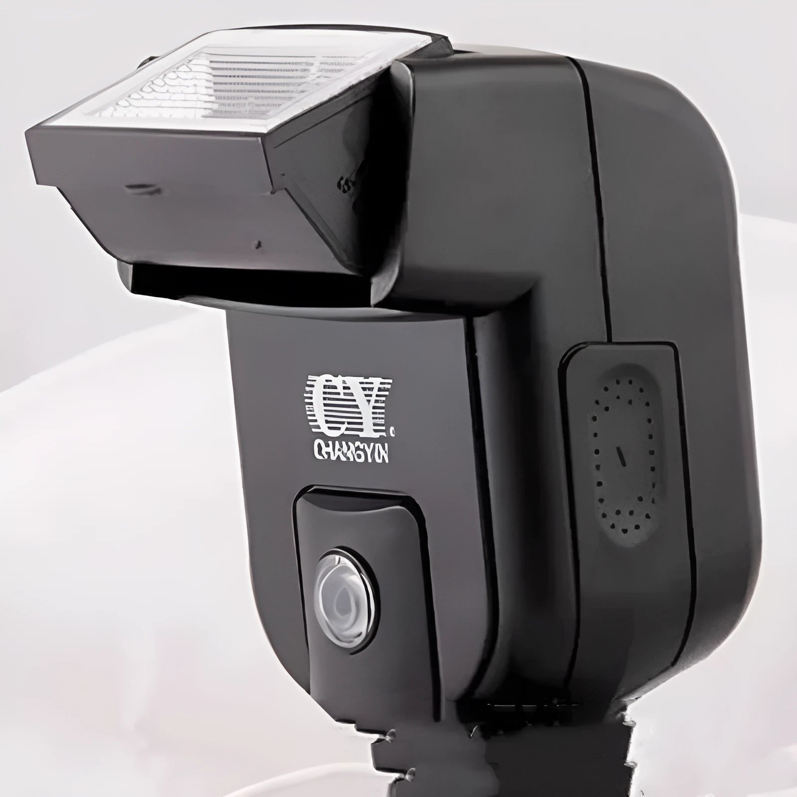 Compact SLR camera flash accessory with its head tilted upwards, showing its 90-degree adjustment range on a hot shoe.