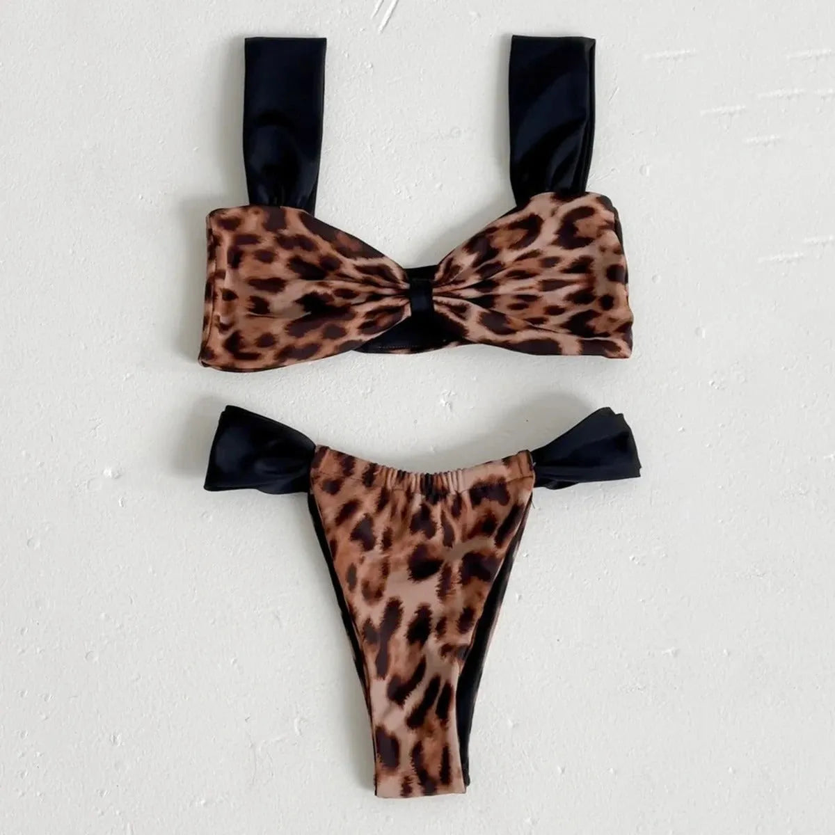 Women's leopard print tube top bikini set with matching T-pants on a mannequin.