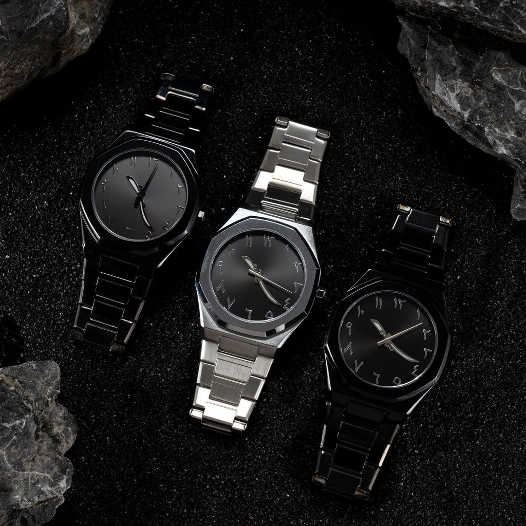 Men's business casual watch with stainless steel band and black dial on wrist