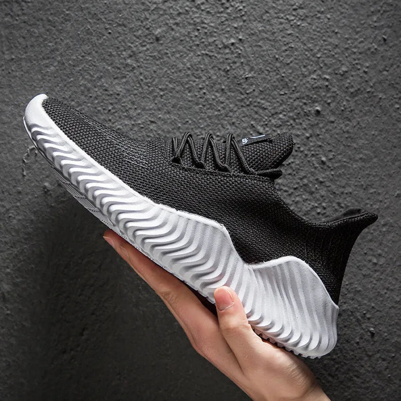 Men's breathable ultra-light running shoes with white upper and grey sole, side view