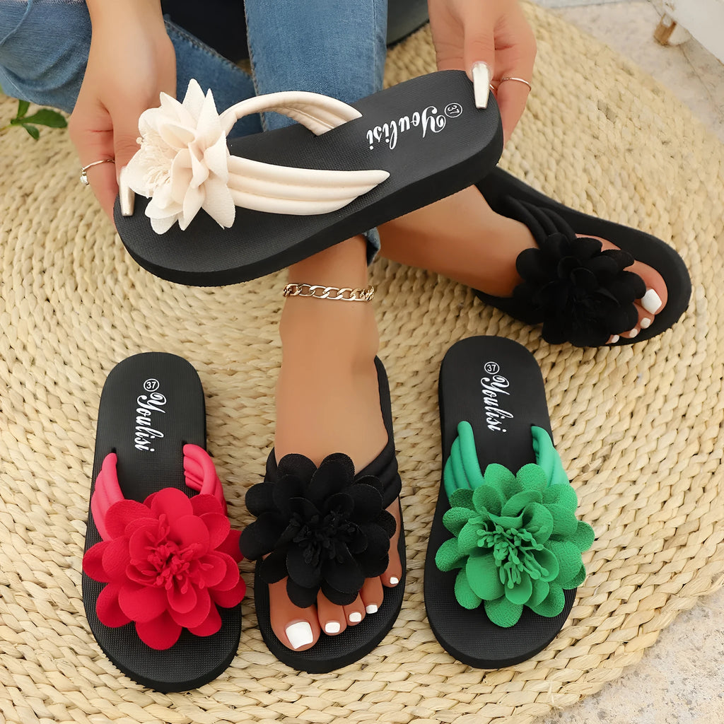 Solid colour flower flip-flops with a floral detail on a viscose upper and a lightweight EVA sole.