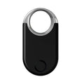 Small black and white GPS anti-lost tracking device for pets and children, showing USB port.