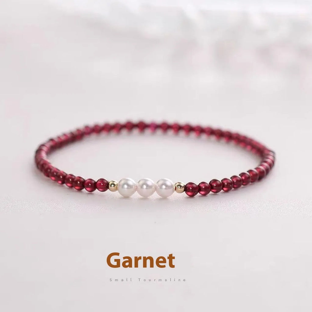 Women's artificial pearl bracelet with Chinese garnet beads in crystal construction