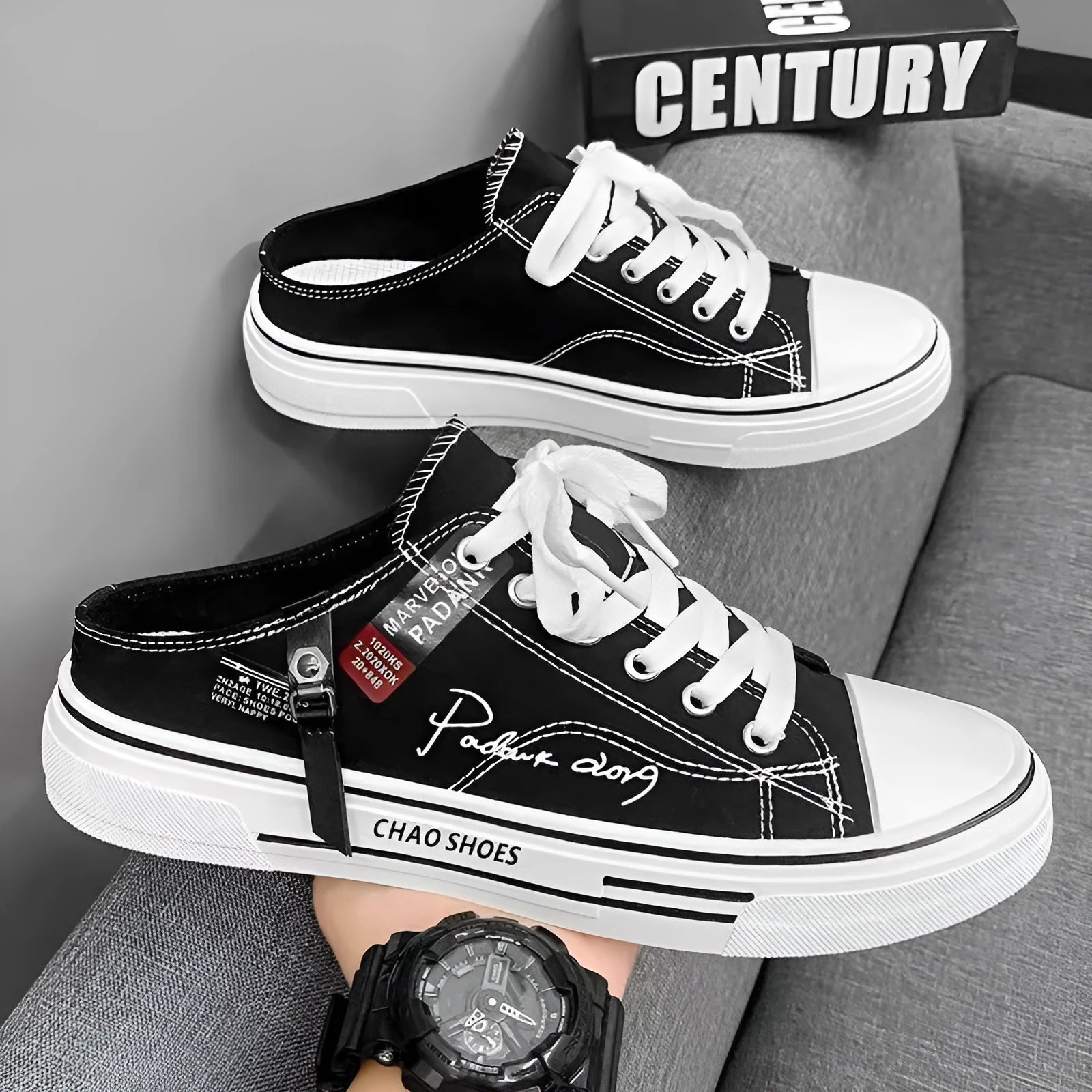 Men's black canvas slip-on casual shoes with round toe and PVC sole.