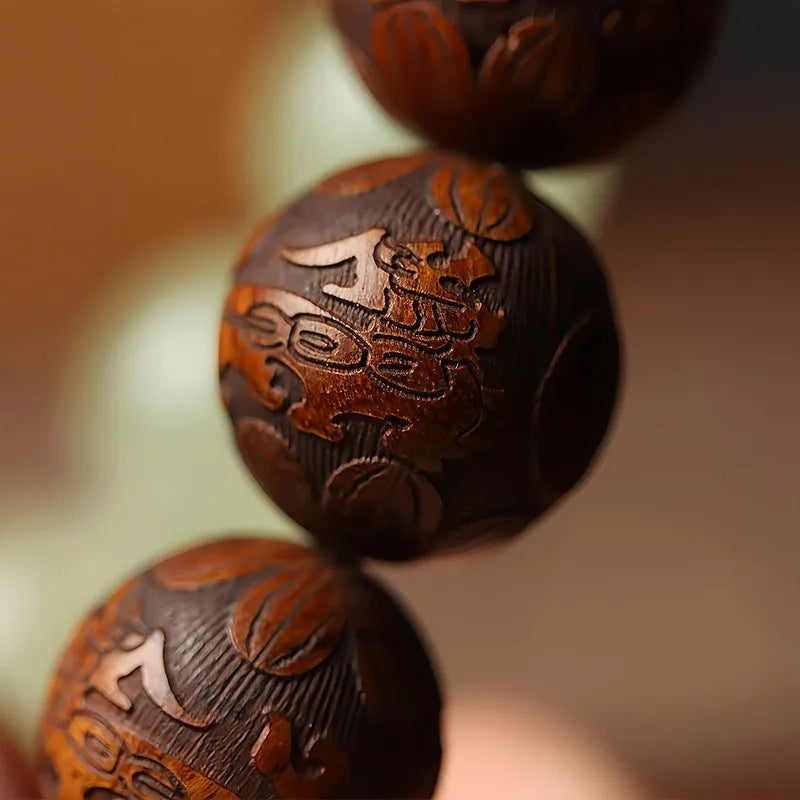 Rosewood bracelet with carved Fu character design in amass fortunes colour, showing 20mm size and flexible ring construction