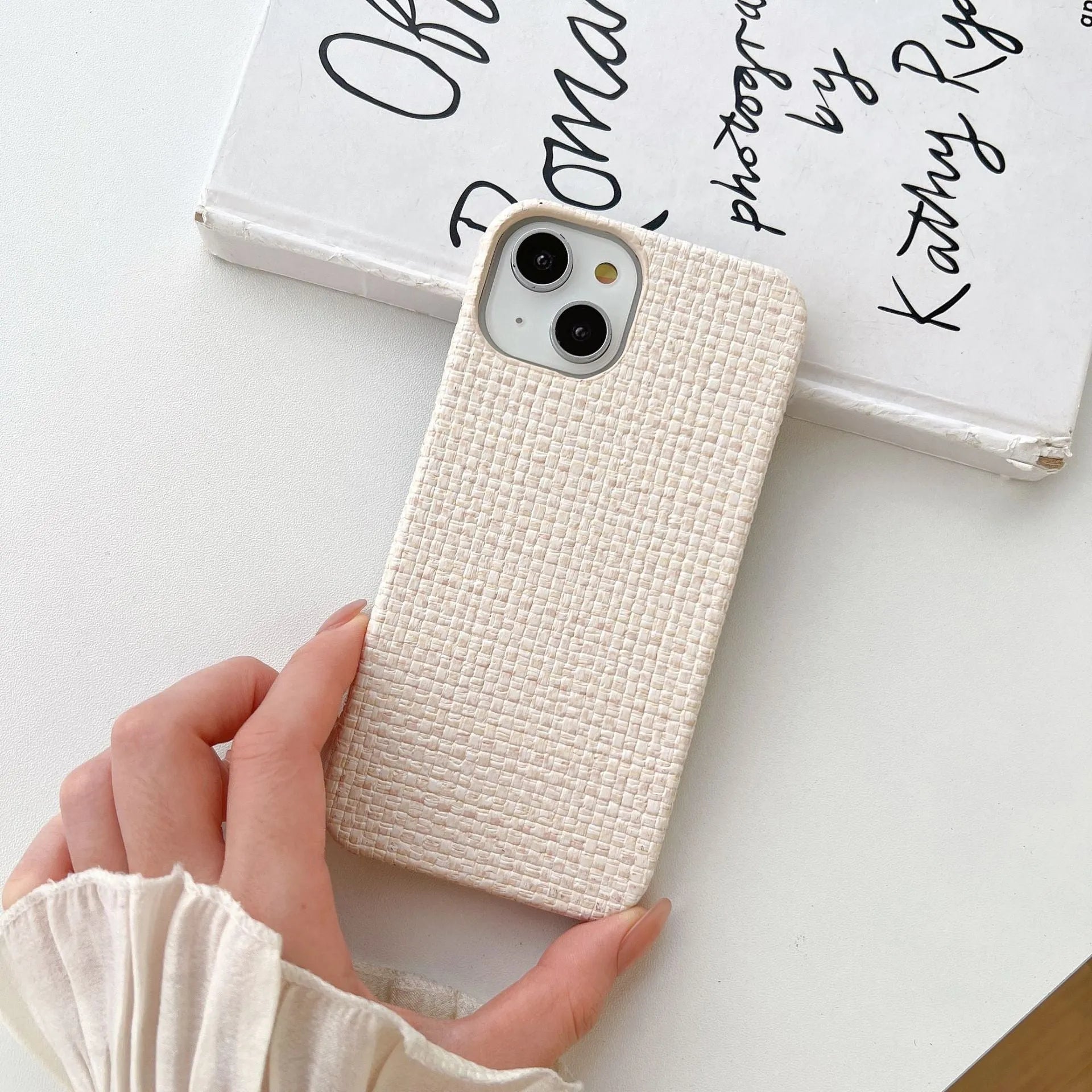 Hand-woven plaid TPU phone case in pink, shown on iPhone, with textured grip pattern and all-inclusive edges.