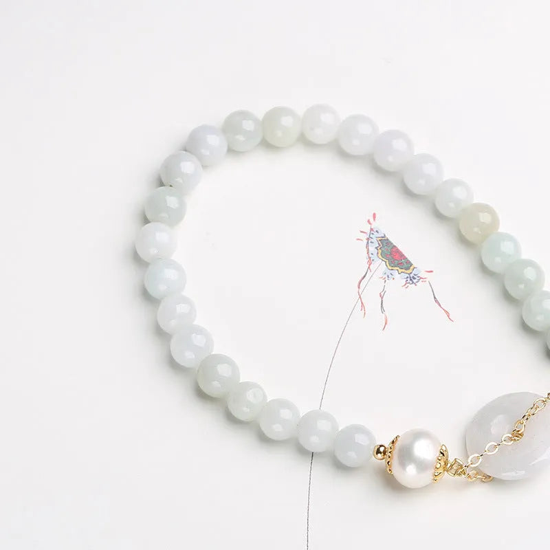 Jade bracelet with emerald peace buckle charm and pearl pendant in geometric national style design