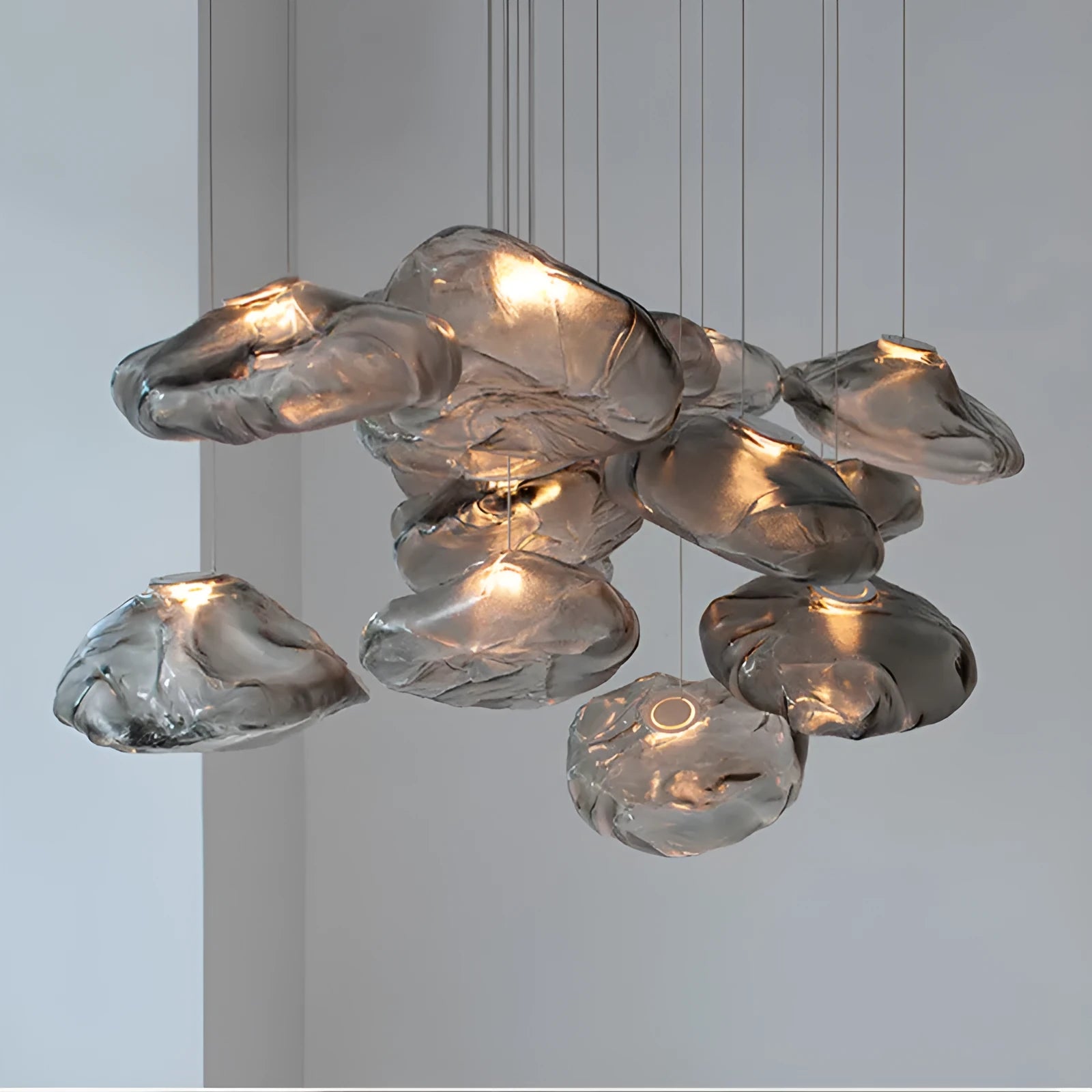 Modern glass chandelier with LED lighting in amber, clear or smoke grey colour options
