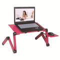 Black folding computer desk with metal frame and cooling fan for laptop use