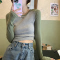 Women's oversized dark blue viscose top with embroidery on the front and long princess sleeves.