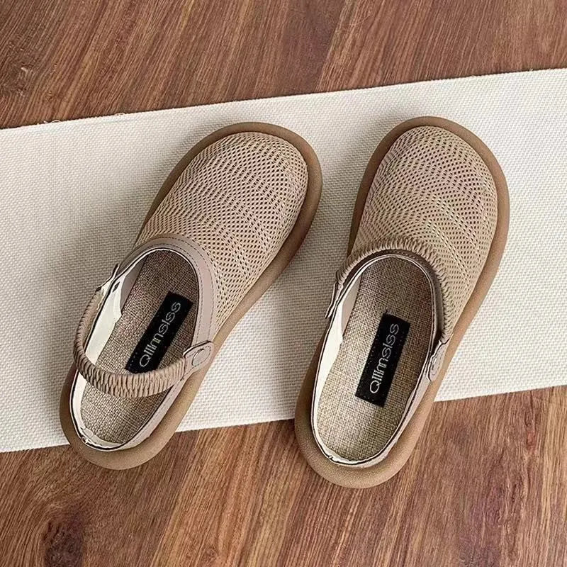 Beige linen slip-on shoes with mesh lining and a light rubber sole on a neutral background.