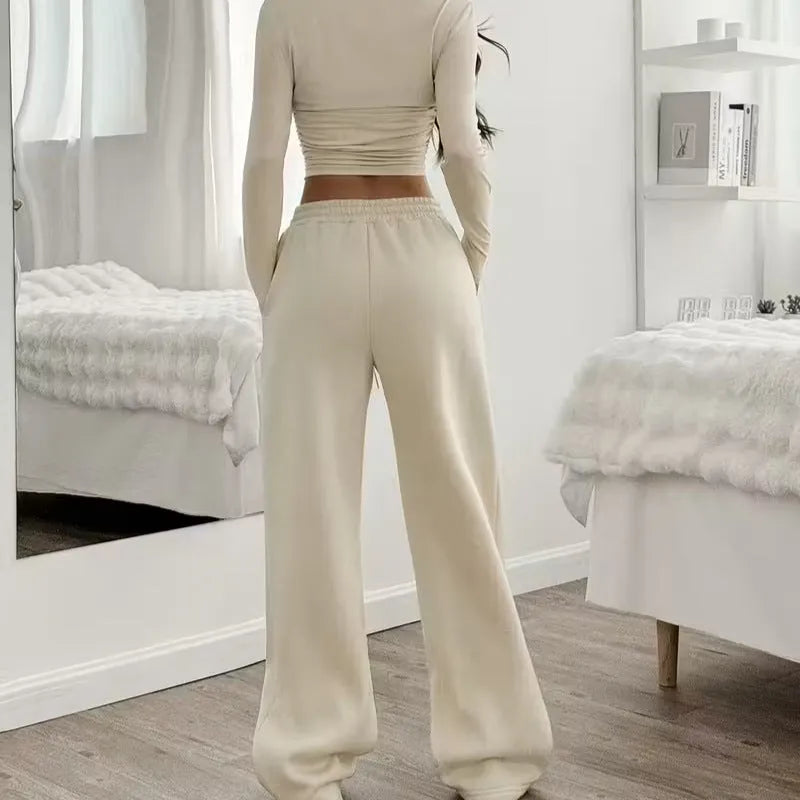 Women's long sleeve solid colour vest and pants suit in beige white polyester knit, sizes S to XL