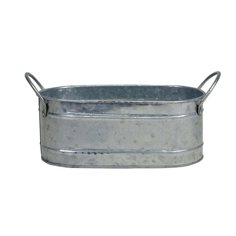 A grey iron sheet succulent flower pot on a wooden desktop.