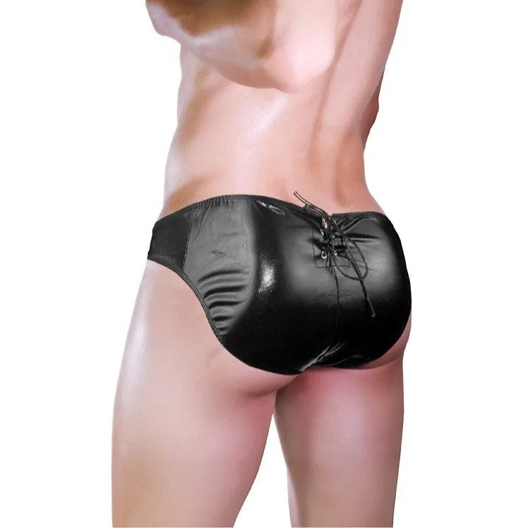 Men's black imitation leather string briefs laid flat showing stretchy waistband