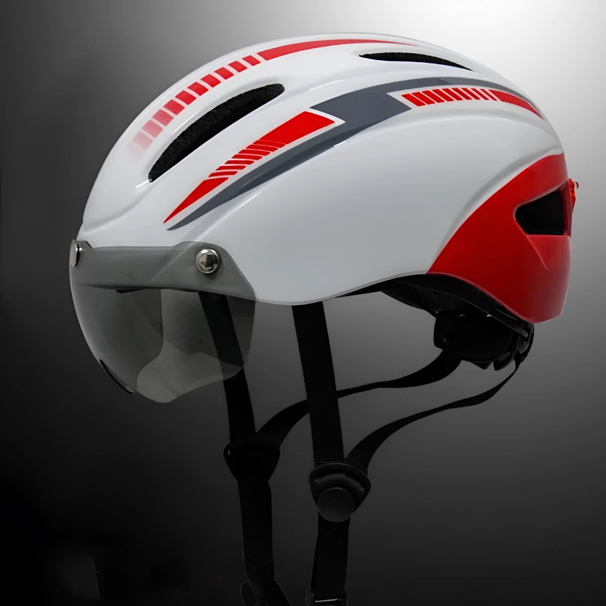 Adult cycling helmet with integrated red taillight on the back, shown in a blue, white, and black colour scheme.