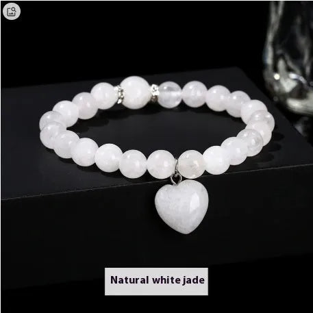 Handmade geometric love pendant bracelet with natural crystal beads in pink, green, white, or yellow.