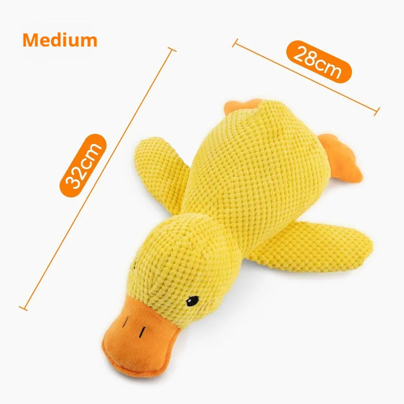 Yellow plush duck dog toy with squeaker for chewing and calming, size option shown