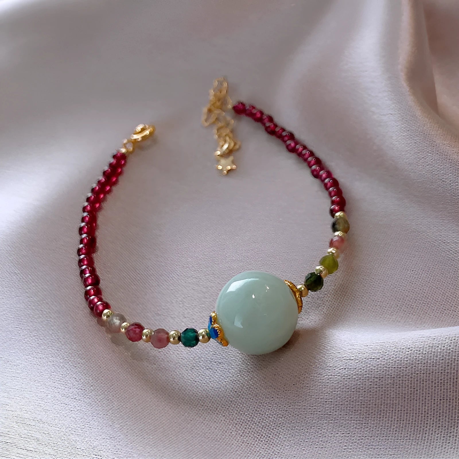 Women's garnet bracelet with aquamarine and tourmaline drop beads in Chinese Korean style design