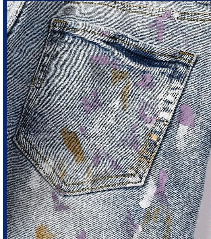 Men's slim fit ripped jeans in light blue with tapered cotton denim, zip fly and double layer belt waist