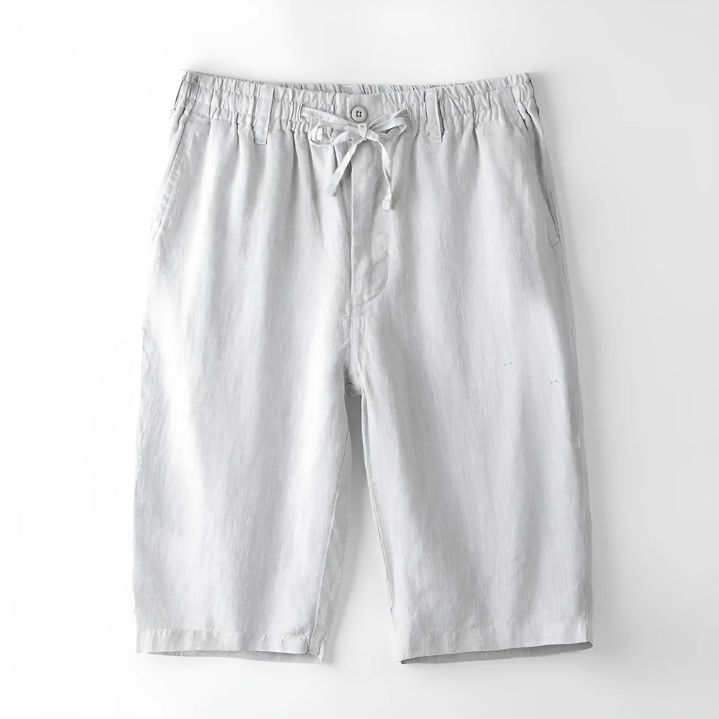Men's light grey linen trousers with a loose straight-leg fit on a plain background.