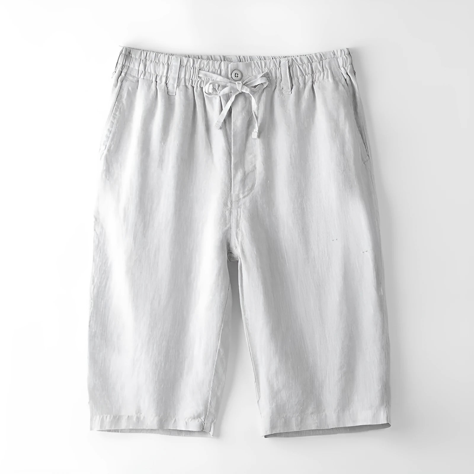 Men's light grey linen trousers with a loose straight-leg fit on a plain background.