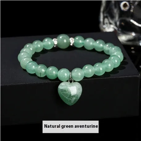 Handmade geometric love pendant bracelet with natural crystal beads in pink, green, white, or yellow.
