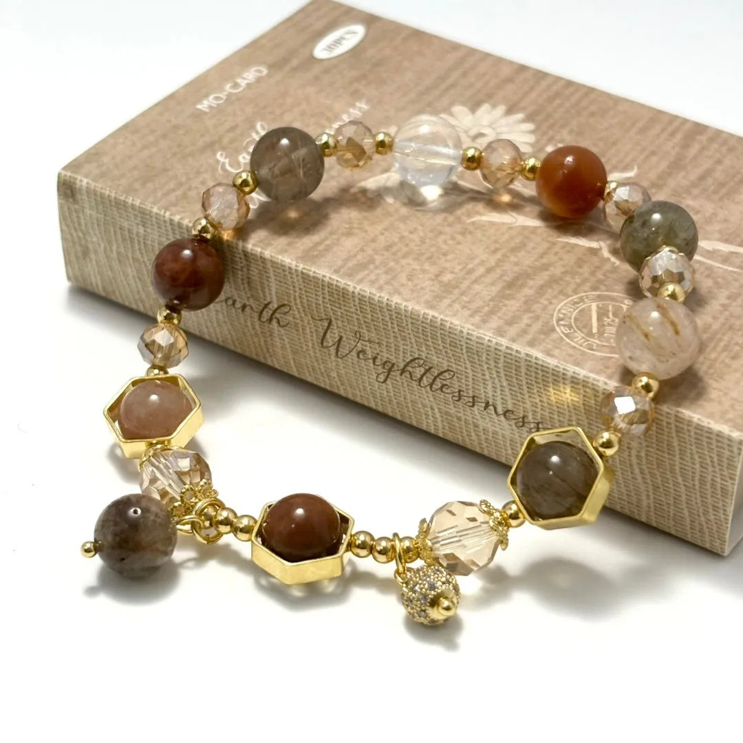 Gold-coloured citrine bracelet with hand-woven construction showing auspicious Chinese symbols
