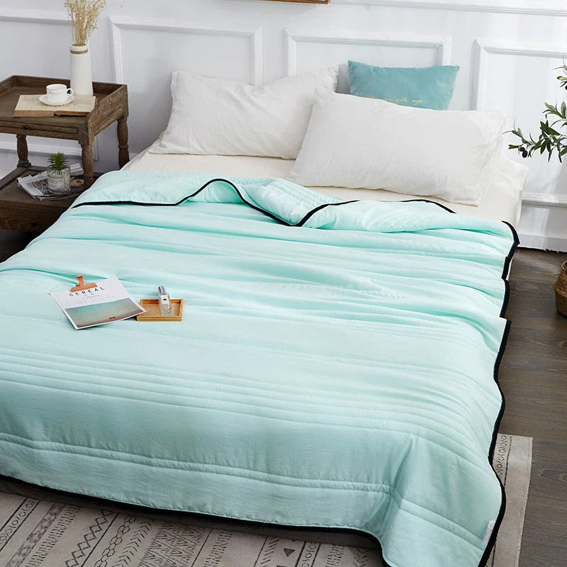 Lightweight, breathable cooling comforter in various colors and sizes for comfortable summer sleep