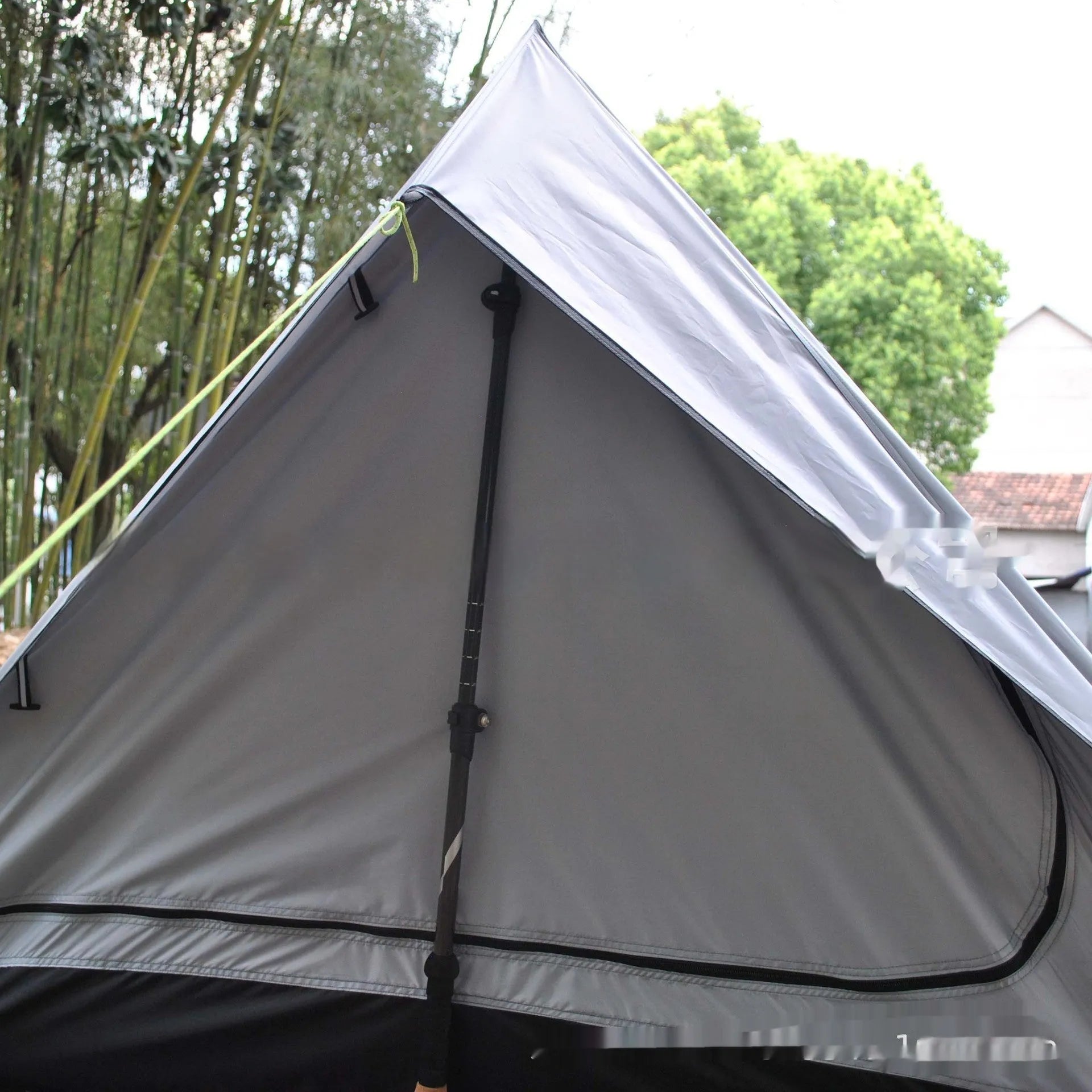 Brown or white A-line pole-free cabin tent for 2-3 people with hiking cane setup.