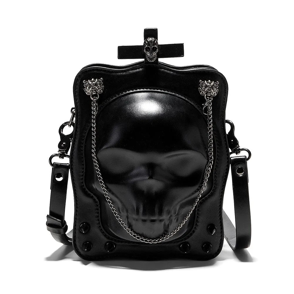 Black mini square crossbody bag with embossed skull design and metal chain strap