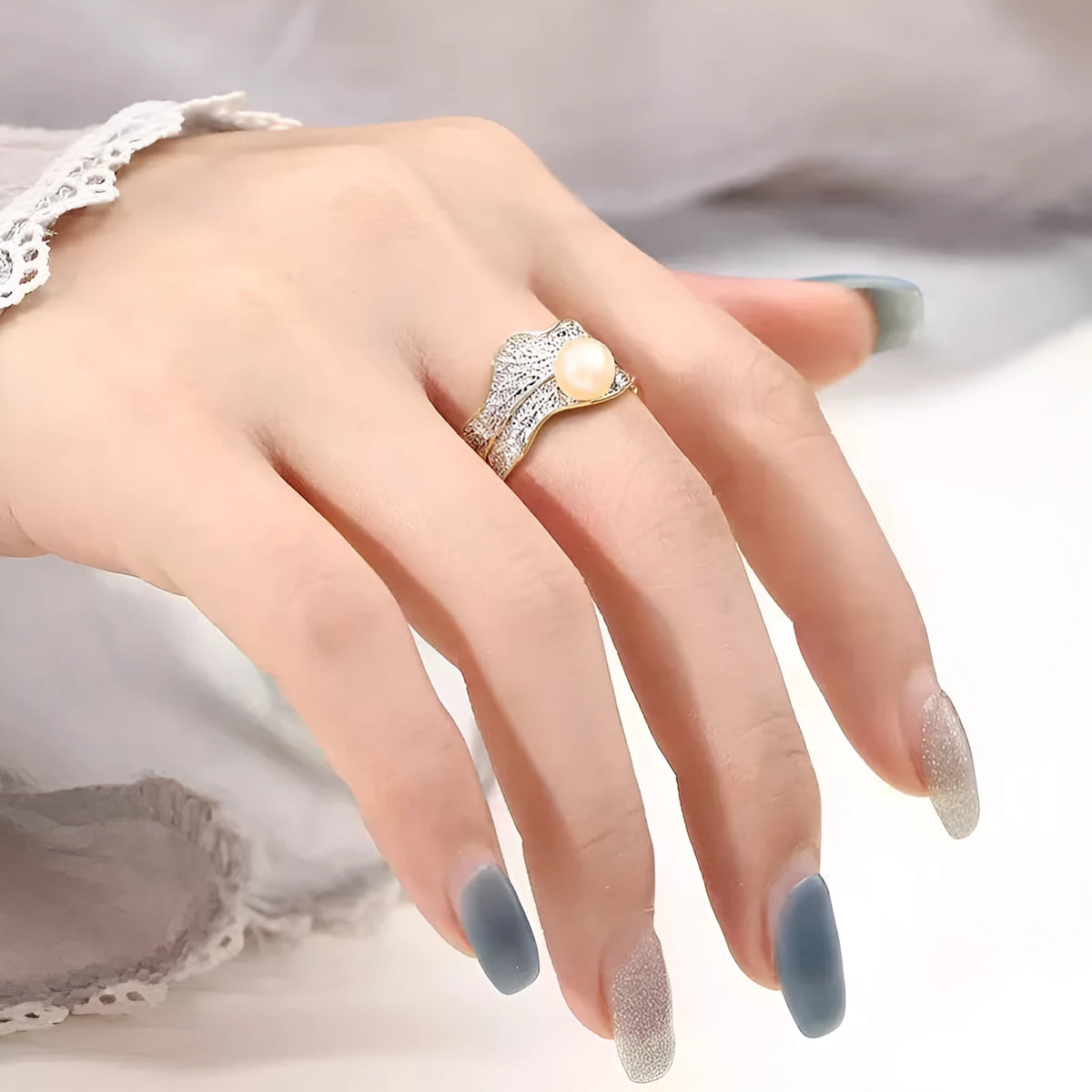 Freshwater pearl ring with irregular leaf design, electroplated metal band, pearl colour, adjustable opening