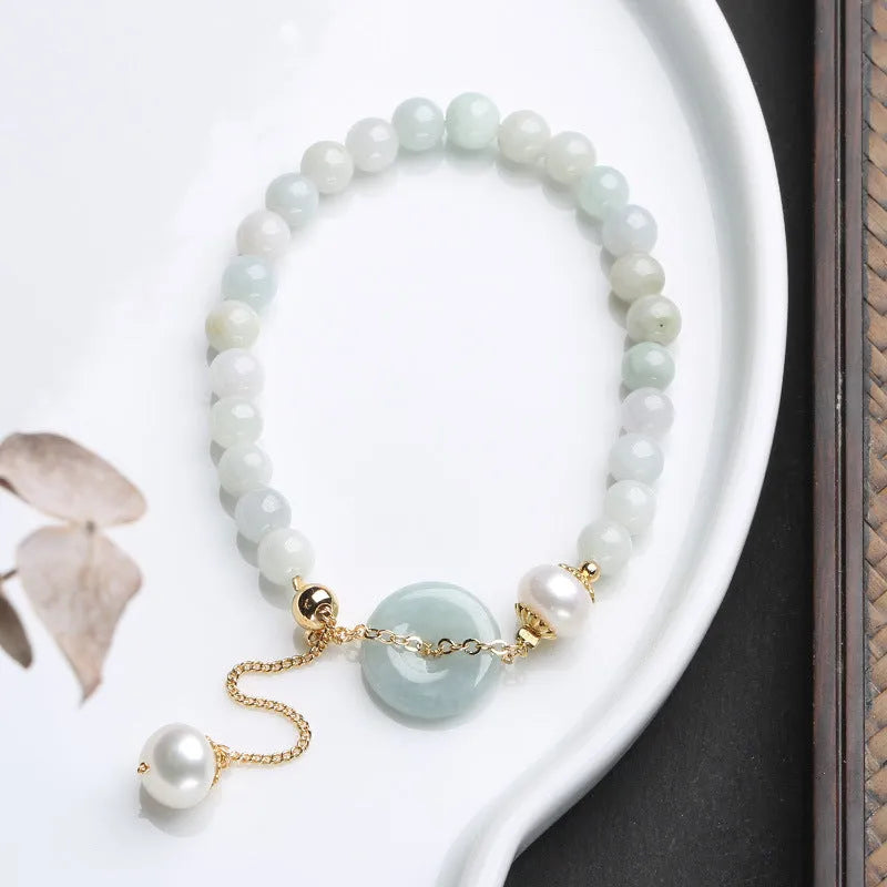 Jade bracelet with emerald peace buckle charm and pearl pendant in geometric national style design
