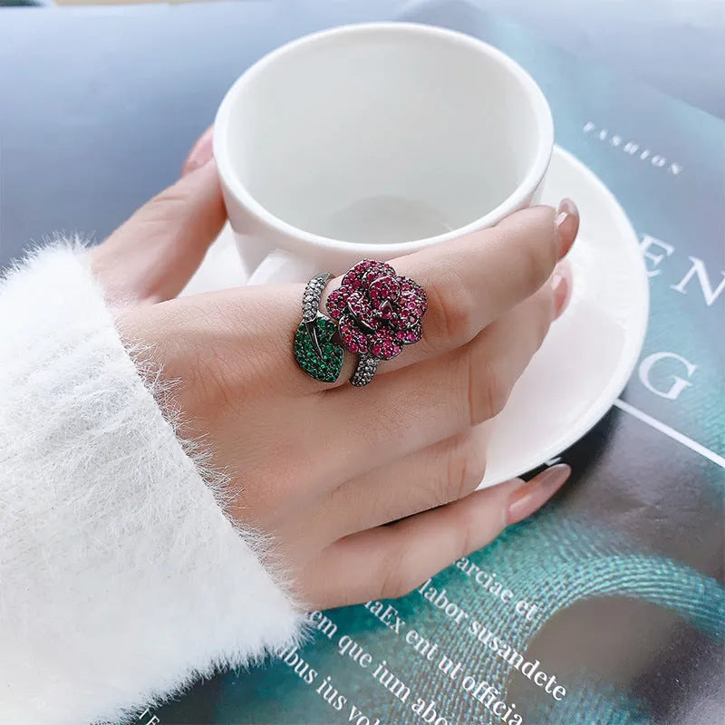 Black gold geometric flower ring with simulated red corundum stone on copper band