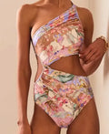 Rose gold patterned women's one-piece swimsuit on a hanger.