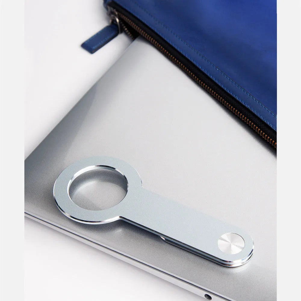 Metallic silver aluminium alloy mobile phone holder for Apple iPhones on desktop