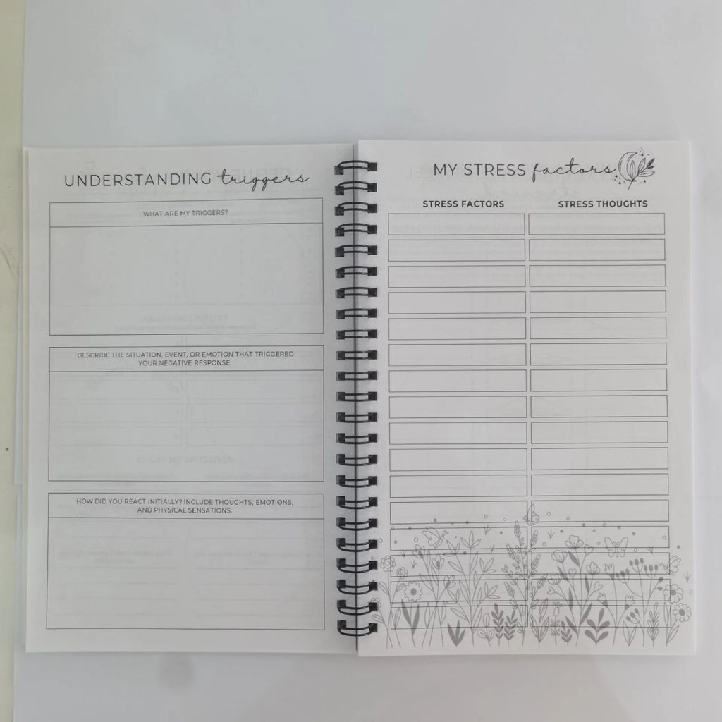 Pink paper cover coil-bound brain mental health notebook with 80g pages, open to blank pages