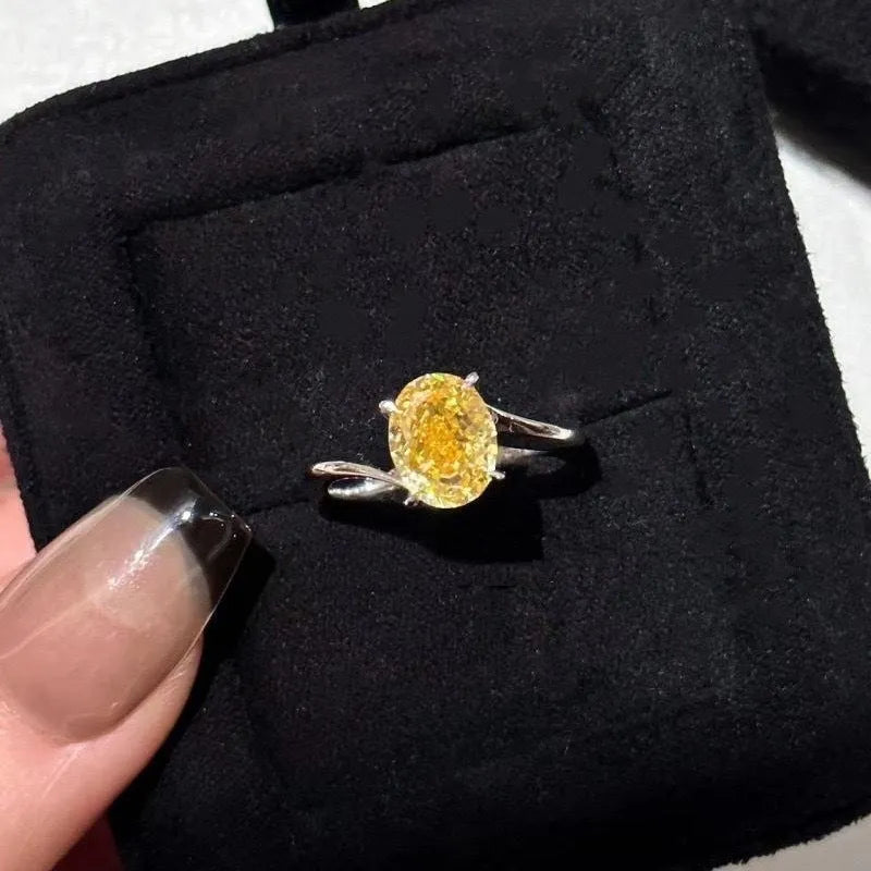 Women's copper ring with a bright yellow crystal sugar finish on a finger.