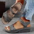Women's beige plus size sandals with a thick composite sole and an adjustable Velcro strap fastener.